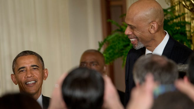 President Barack Obama and former NBA basketball player Kareem Abdul Jabbar talk in the East Room of the White House in Washington, Friday, Jan. 30, 2015. Photo: Pablo Martinez Monsivais, AP