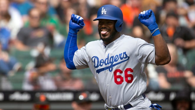 Sept. 29: The Los Angeles Dodgers' Yasiel Puig celebrates his solo home run against the San Francisco Giants at AT&T Park. The Dodgers won the game, 10-6.
