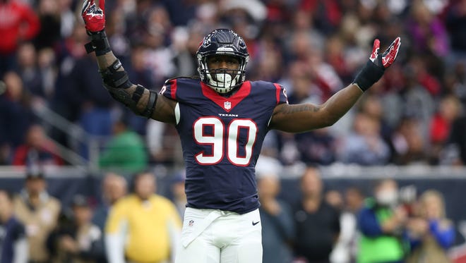 Houston Texans defensive end Jadeveon Clowney (90) reacts in the first quarter against the Oakland Raiders  in the AFC Wild Card playoff football game at NRG Stadium.