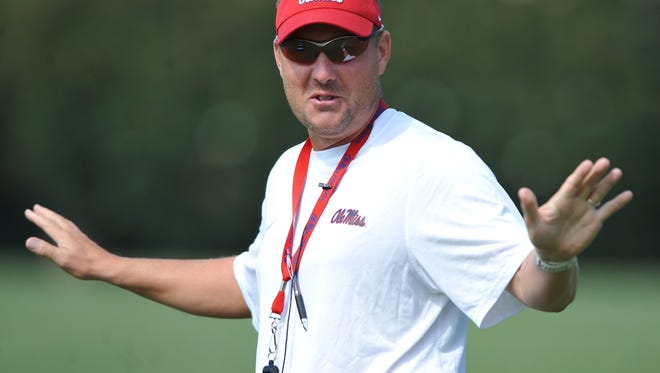 Mississippi's Hugh Freeze, at football practice in Oxford, Miss. on Saturday, Aug. 2, 2014, is beginning his third season as the Rebels head coach.