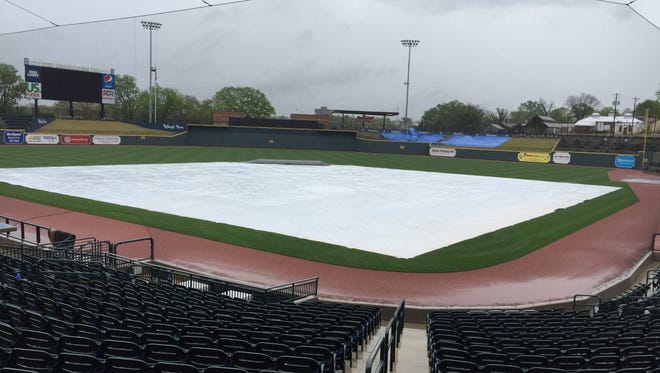 A tarp covers the field at Spirit Communications Park on the eve of Tim Tebow's minor league debut with the Columbia Fireflies.