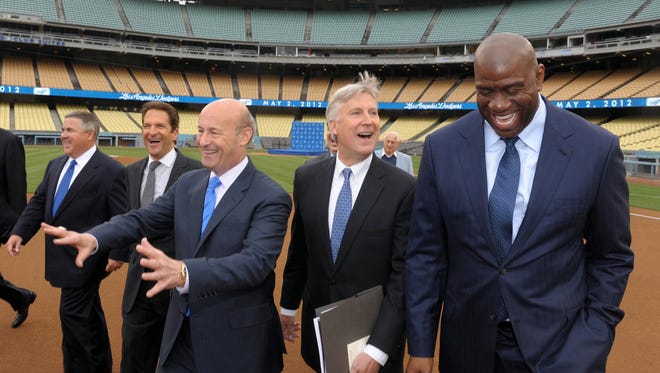 2012: Members of the Guggenheim baseball management team arrive at press conference to announce their purchase of the Los Angeles Dodgers at Dodger Stadium.