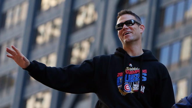 Cubs president Theo Epstein waves to the crowd.