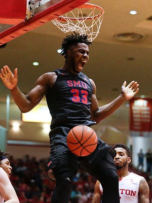 Southern Methodist Mustangs forward Semi Ojeleye (33) dunks against the Houston Cougars in the first half at Hofheinz Pavilion.