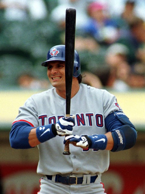 Jose Canseco slugs 46 home runs in his only season with the Blue Jays in 1998.