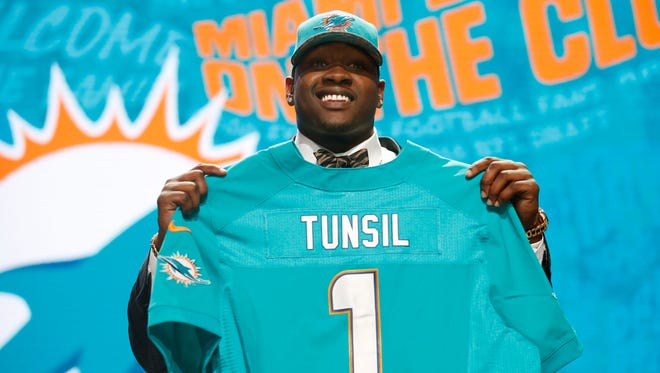 Laremy Tunsil (Mississippi) is selected by the Miami Dolphins as the number thirteen overall pick in the first round of the 2016 NFL Draft at Auditorium Theatre.