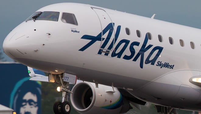 An Alaska Airlines Embraer E170 operated by affiliate SkyWest lands at Seattle-Tacoma International Airport on May 18, 2017.