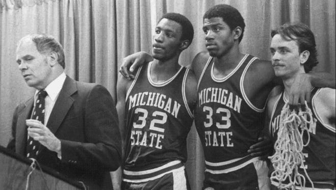 1979: Greg Kelser, left, Earvin "Magic" Johnson, center, and Terry Donnely listen to Michigan State coach Jud Heathcote during a news conference.