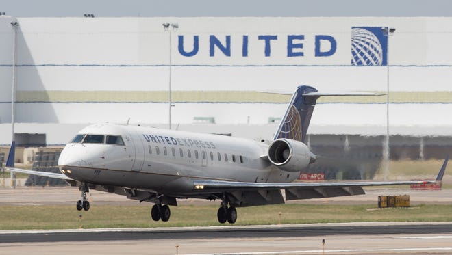 A United Express CRJ regional lands at Denver International Airport on May 7, 2017.