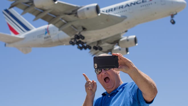 A gentleman has fun taking a selfie with an arriving Air France Airbus A380 near Los Angeles International Airport on May 13, 2017.