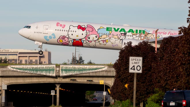 EVA Air's Hello Kitty Boeing 777 touches down at Seattle Tacoma International Airport in May 2017.
