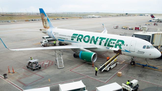 A Frontier Airbus A320 is leaded for its next flight from Denver International Airport on May 7, 2017.