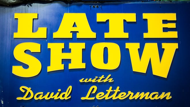 Michael Szajewski, head of archives for Bracken Library at Ball State University, visits the Late Show marquee housed in a storage facility off campus.
