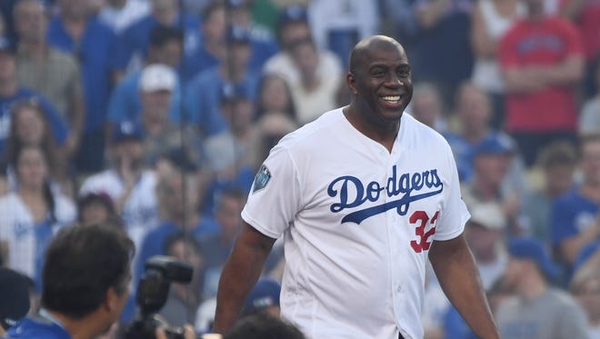2018: Magic Johnson tosses out the ceremonial first pitch before Game 3 of the World Series.