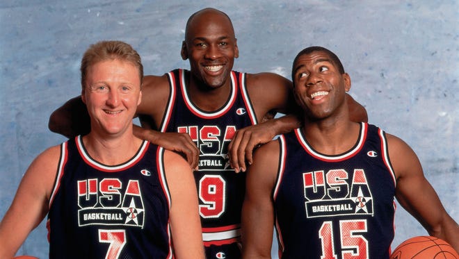 1992: Larry Bird #7, Michael Jordan #9, and Magic Johnson #15 of the United States National Team pose for a photo.
