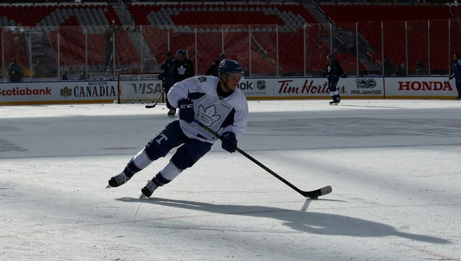 Maple Leafs right wing Nikita Soshnikov (26) skates with the puck during practice for the Centennial Classic.