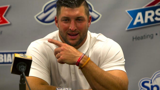 April 6: Tim Tebow meets the media after his first game.
