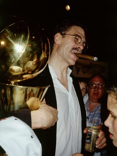 1991: Jackson holds the Larry O'Brien Trophy.