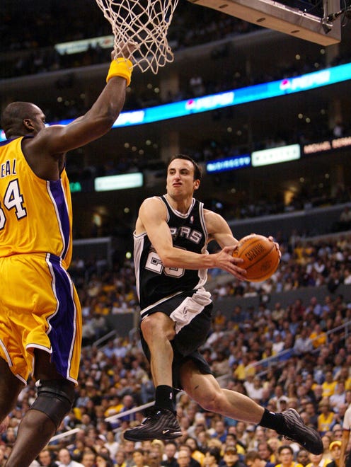 2003: Ginobili hangs in the air as he drives to the hoop on the Lakers' Shaquille O'Neal in Game 6 of the Western Conference semifinals.