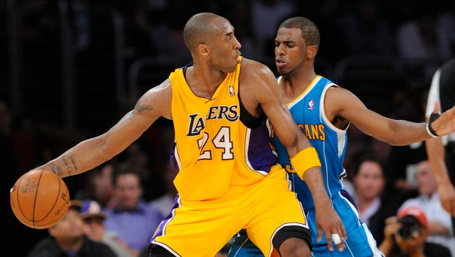 2011: Kobe Bryant (24) is guarded by New Orleans Hornets point guard Chris Paul (3).