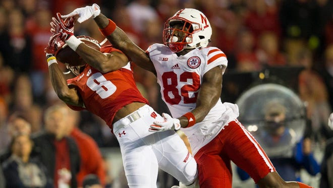 Wisconsin cornerback Sojourn Shelton (8) intercepts the pass intended for Nebraska wide receiver Alonzo Moore (82) during the first quarter.