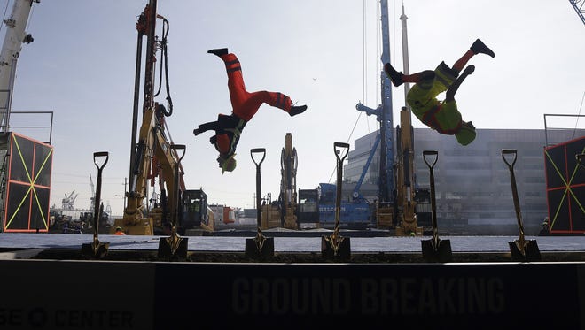 A group performs during a ground breaking ceremony for the Golden State Warriors' new arena, the Chase Center, in San Francisco.