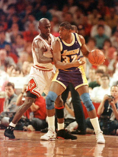 1991: Earvin 'Magic" Johnson backs down Chicago Bulls' Michael Jordan.