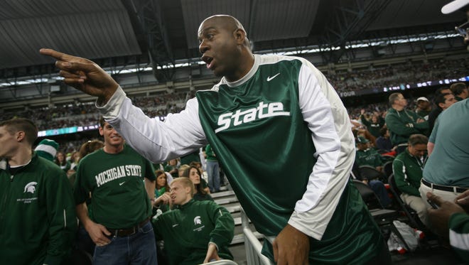 2009: Magic Johnson greets the crowd at the NCAA Final Four game between the MSU Spartans and the Connecticut Huskies.
