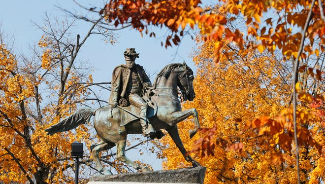 Fall leaves frame the statue of Confederate Maj. Gen. J.E.B. Stuart on Monument Ave in Richmond, Va., in this Nov. 12, 2014 photo.