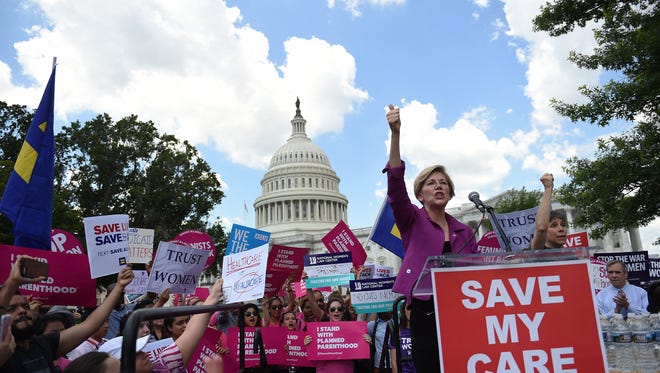 Sen. Elizabeth Warren, D-Mass., speaks at a rally to oppose the repeal of the Affordable Care Act on Capitol Hill on June 21, 2017.
