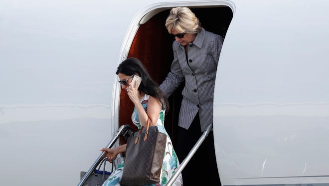 Clinton and Abedin arrive at Van Nuys Airport in Van Nuys, Calif., on Aug. 22, 2016.