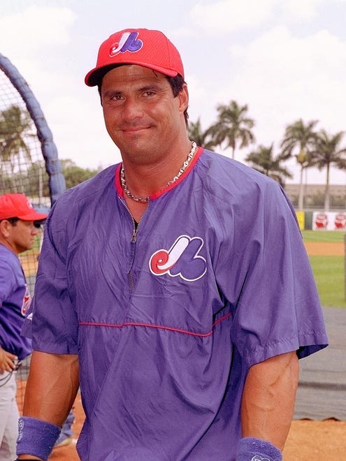 Jose Canseco signs with the Expos in 2002 but is released after just over a month in spring training.