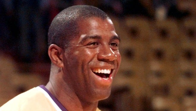 1996: Magic Johnson in his pre game warm-up.