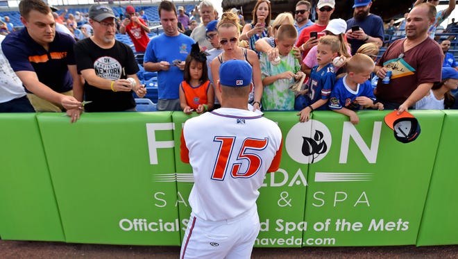 Aug. 3: Tim Tebow signs autographs for fans.