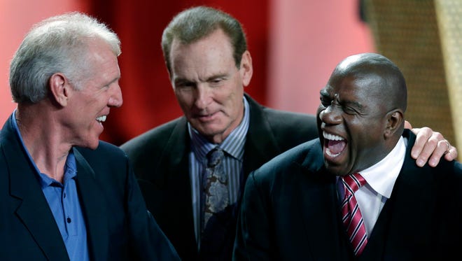 2012: Earvin "Magic" Johnson, right, laughs with Bill Walton, left, and Rick Barry during the enshrinement ceremony for the 2012 class of the Naismith Memorial Basketball Hall of Fame.