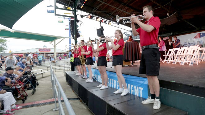 The Kids from Wisconsin band plays before the Wisconsin state fair opening ceremonies at the Bank Mutual Amphitheater.