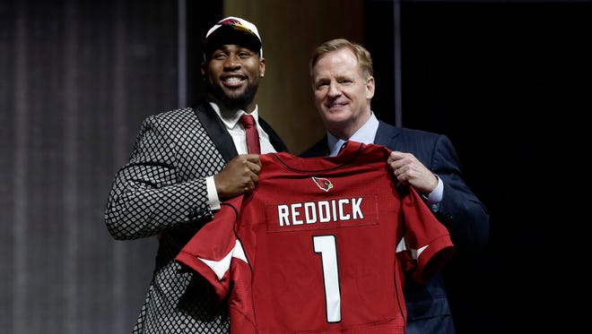 Temple's Haason Reddick, left, poses with NFL commissioner Roger Goodell after being selected by the Arizona Cardinals during the first round of the 2017 NFL football draft, Thursday, April 27, 2017, in Philadelphia.