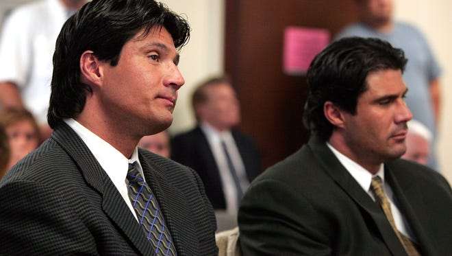 Ozzie Canseco, left, and his twin brother Jose Canseco listen as Circuit Judge Herbert Stettin reads a jury's verdict that found them liable in a lawsuit by two men whom they beat up at a Miami Beach nightclub on Halloween 2001.