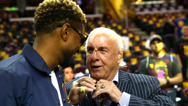Ric Flair talks with recording artist Usher at Game 3 of the 2017 NBA Finals.