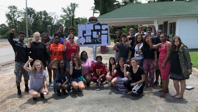 The group called Cultural Leadership is shown with the Emmett Till marker.
