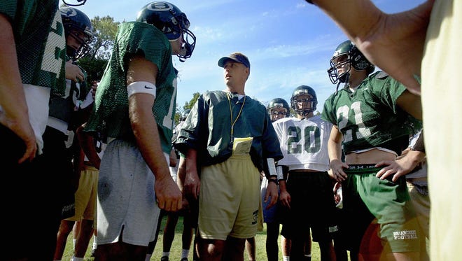 September 27, 2000 - Briarcrest coach Hugh Freeze meets with players during practice Wednesday afternoon as they prepare for their showdown with ECS Friday.