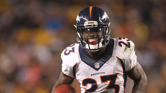 Denver Broncos running back Ronnie Hillman (23) rushes the ball against the Pittsburgh Steelers during the second quarter at Heinz Field.