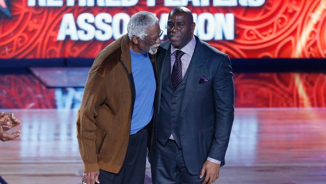 2017: Former NBA players Bill Russell (L) and Earvin "Magic" Johnson Jr. are honored during the 2017 NBA All-Star Game.