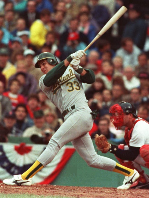 Jose Canseco breaks into the majors in 1985 and slugs 462 home runs over 17 seasons.