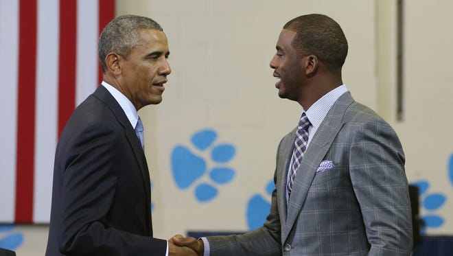 Chris Paul of the Los Angeles Clippers introduces President Barack Obama at the Walker Jones Education Campus on July 21, 2014 in Washington, DC.