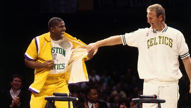 1993: Larry Bird #33 of the Boston Celtics with Magic Johnson of the Los Angeles Lakers during Larry Bird Night at the Boston Garden.