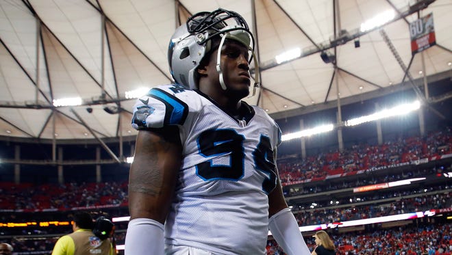 Kony Ealy #94 of the Carolina Panthers walks off the field after losing to the Atlanta Falcons at the Georgia Dome on December 27, 2015 in Atlanta, Georgia.