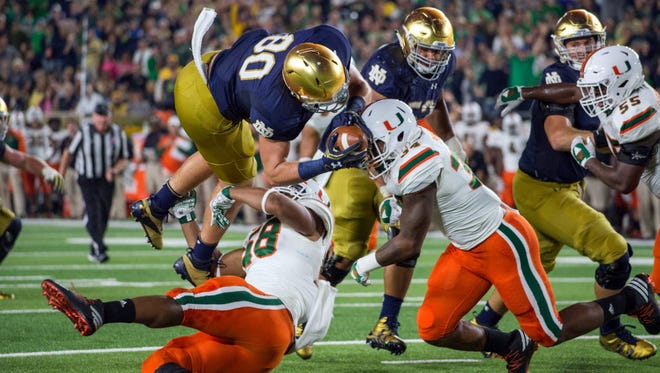 Notre Dame tight end Durham Smythe (80) attempts to dive into the end zone against Miami.