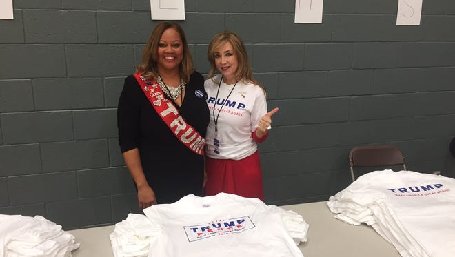 Volunteers Cynthia Love and Julie Fisher hand out free T-shirts to those attending the Donald Trump Jr. rally at ASU on Oct. 27, 2016.