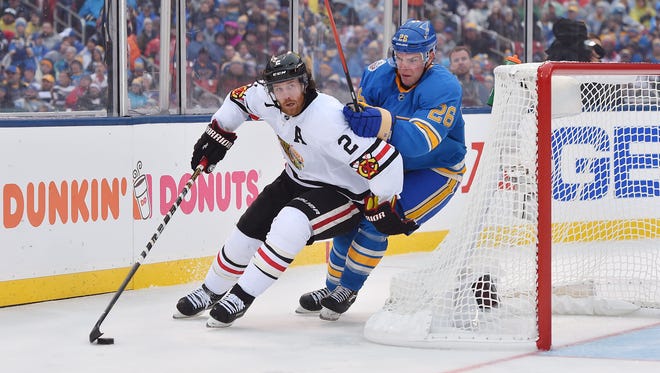 Chicago Blackhawks defenseman Duncan Keith (2) battles for the puck with St. Louis Blues center Paul Stastny (26) during the second period in the 2016 Winter Classic.